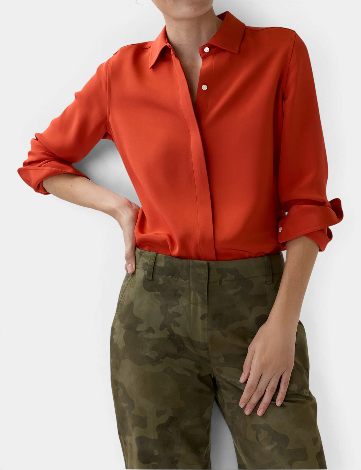 The Copper Shed classic silk blouse in vibrant orange with a point collar and mother-of-pearl buttons.