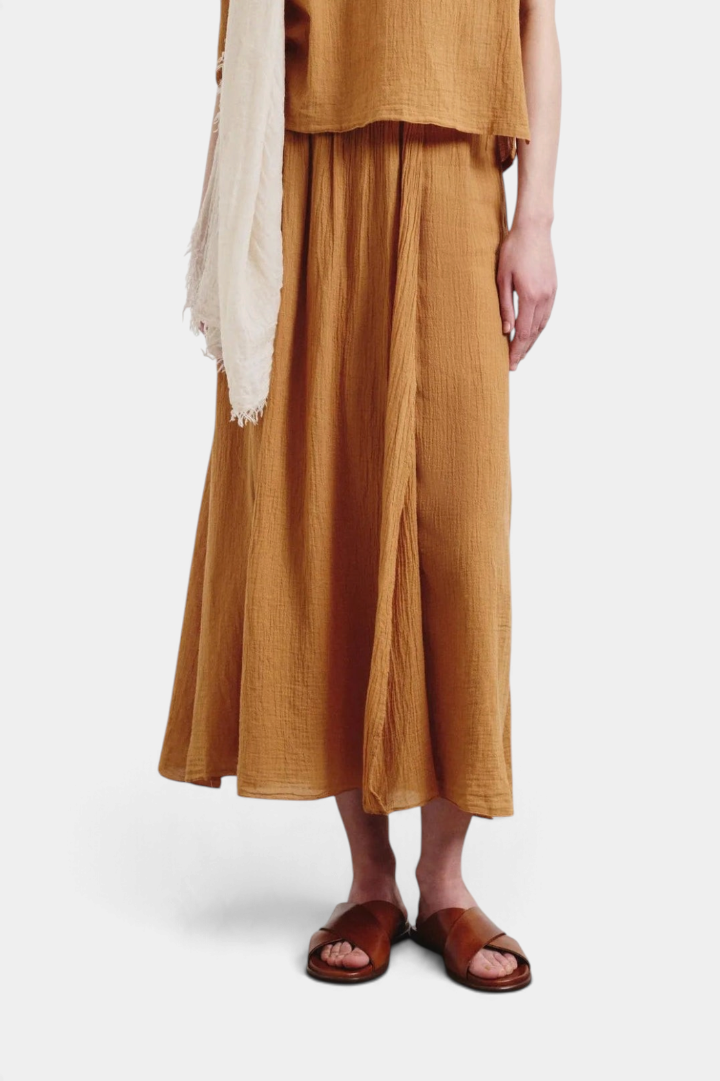 The Copper Shed organic cotton crepe gauze skirt in ochre with front gathers and a fluid, oversized silhouette.