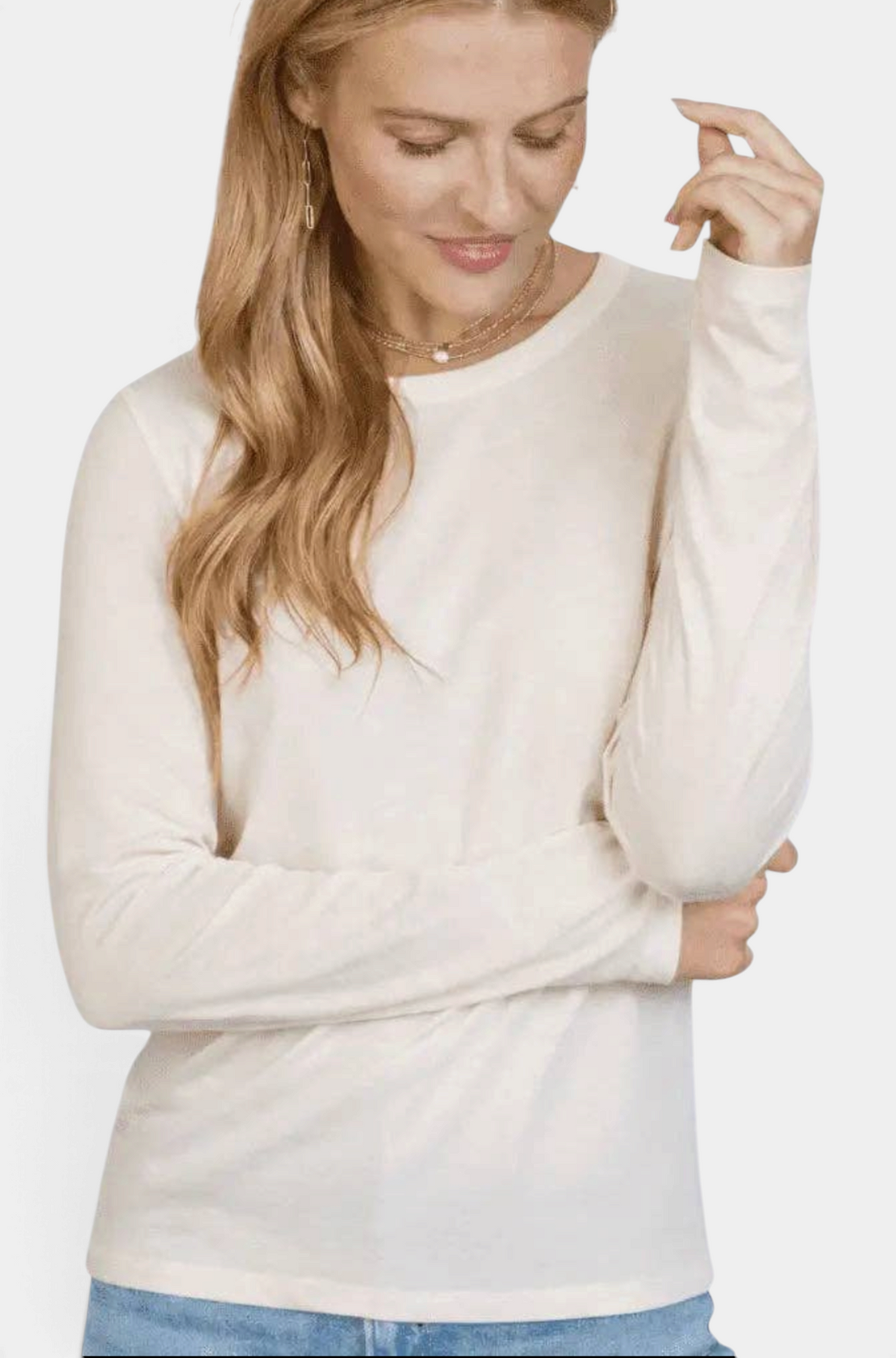 Woman wearing The Copper Shed Weekender long sleeve tee in oyster cotton with a ribbed neckline and slim fit