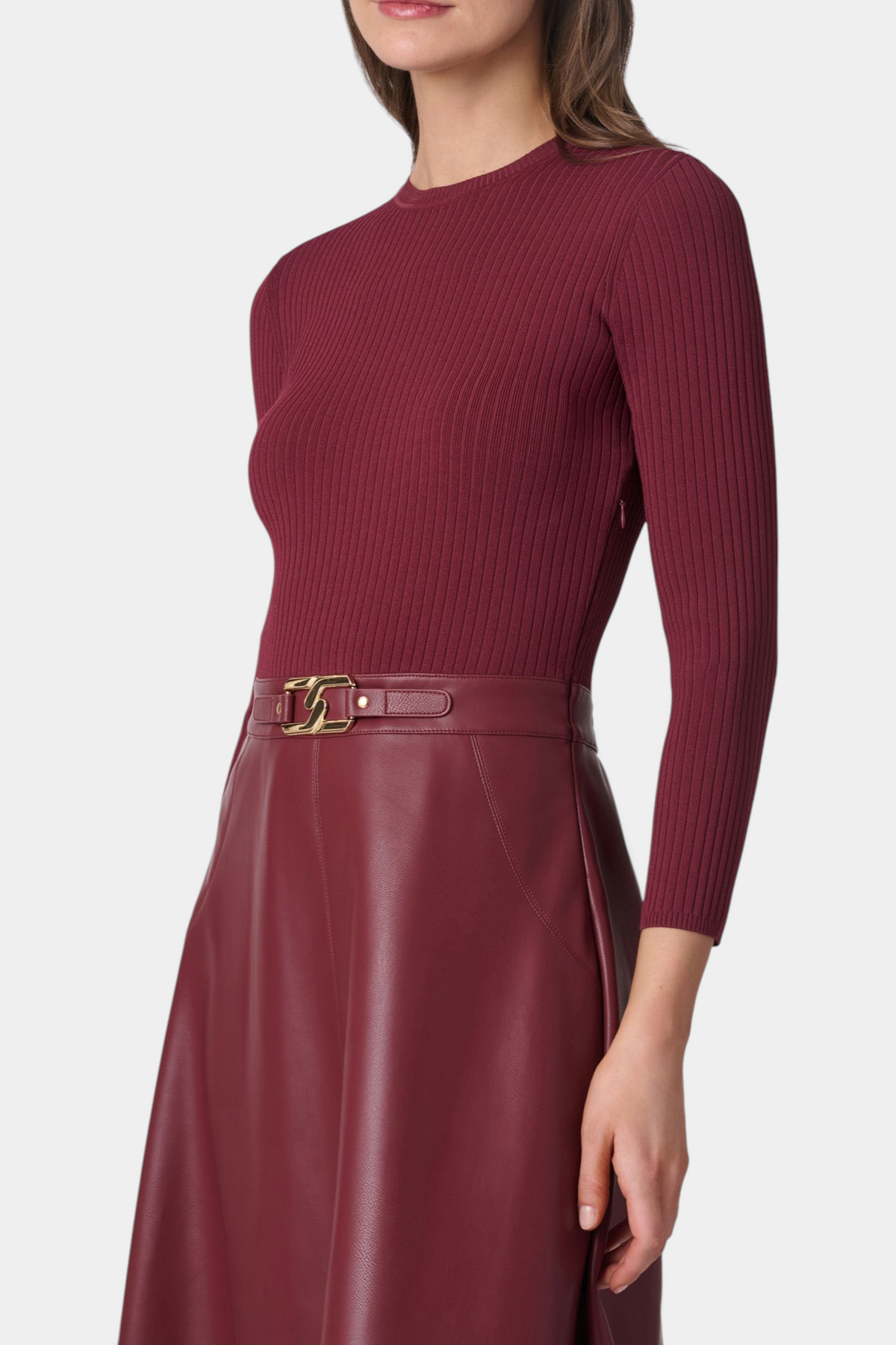 The Copper Shed Paige midi dress with a burgundy ribbed knit bodice and matching faux leather A-line skirt.