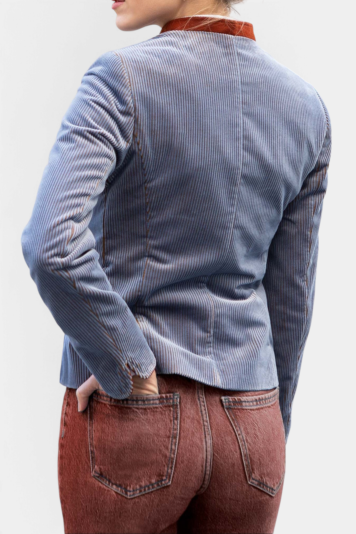 The Copper Shed women's pale blue corduroy blazer with a brown collar, shown from the back.