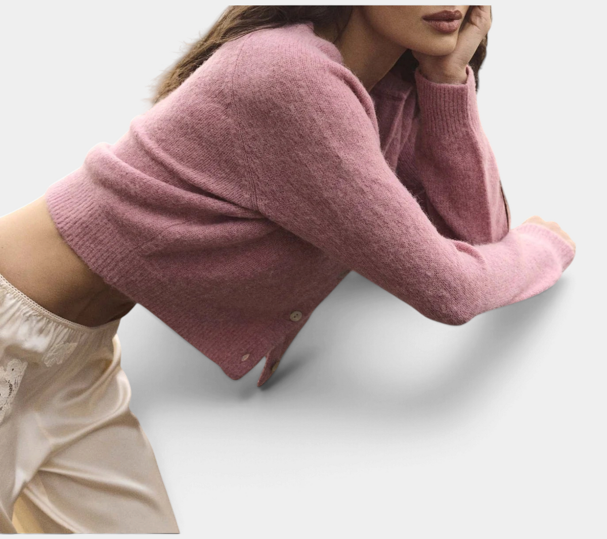 The Copper Shed Petra Cardigan in soft pink alpaca and merino wool blend with shell buttons and ribbed trim.
