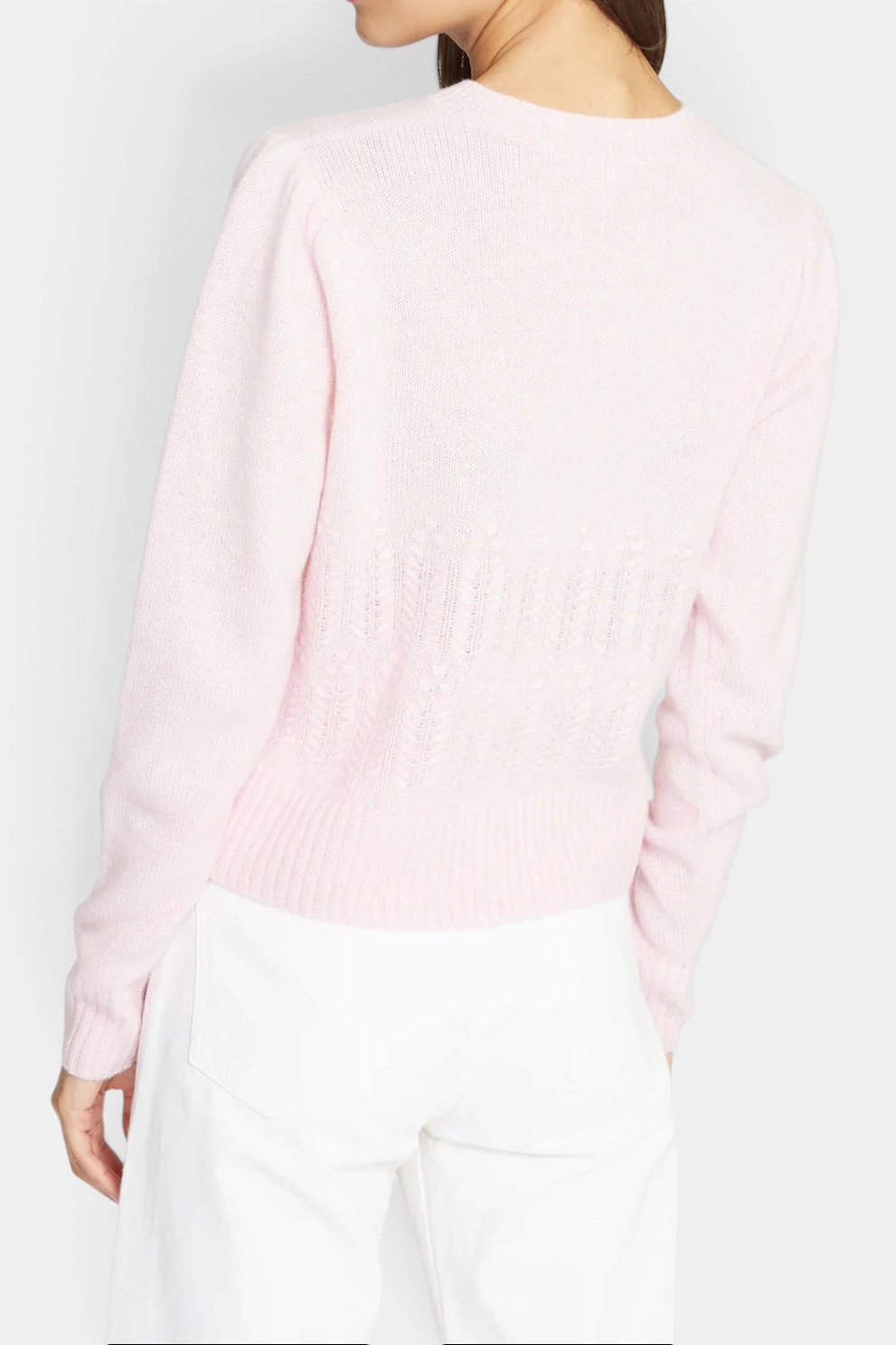 The Copper Shed heather pink cashmere cardigan with puff sleeves and popcorn stitch detail, back view on a model.