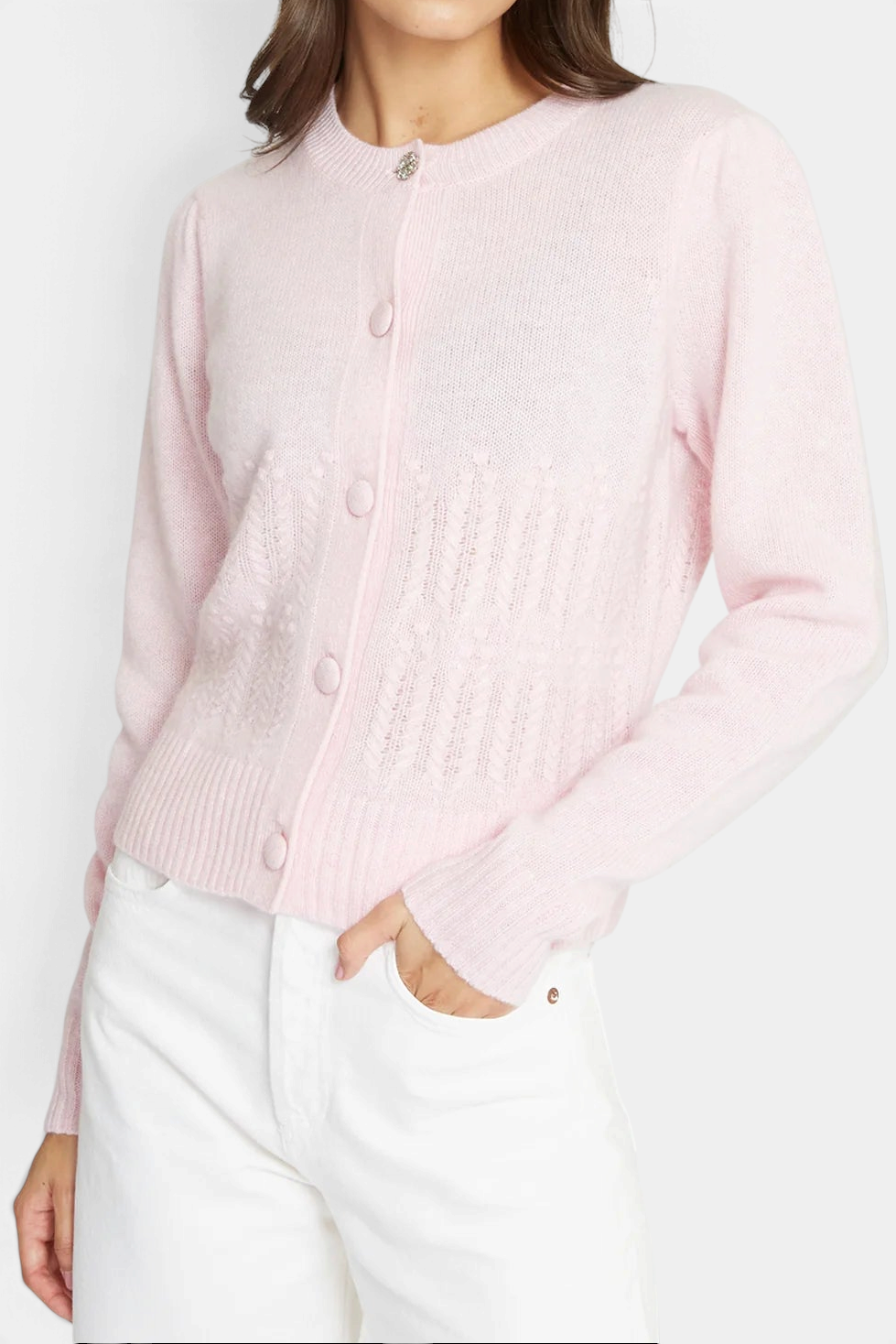 The Copper Shed heather pink cashmere cardigan with popcorn stitch, puff sleeves, and a crystal button closure.