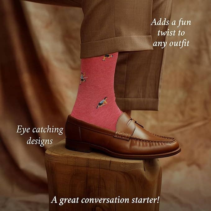 The Copper Shed pink novelty socks featuring runner motifs, worn with brown trousers and leather loafers.