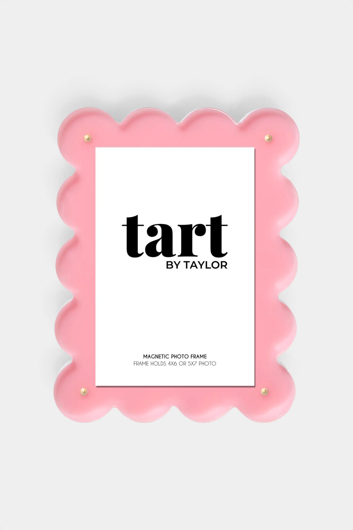 The Copper Shed pink acrylic picture frame with a scalloped edge and magnetic closure for 4x6 or 5x7 photos.