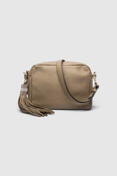 The Copper Shed Princess leather crossbody bag in taupe with a long decorative tassel and adjustable shoulder strap.