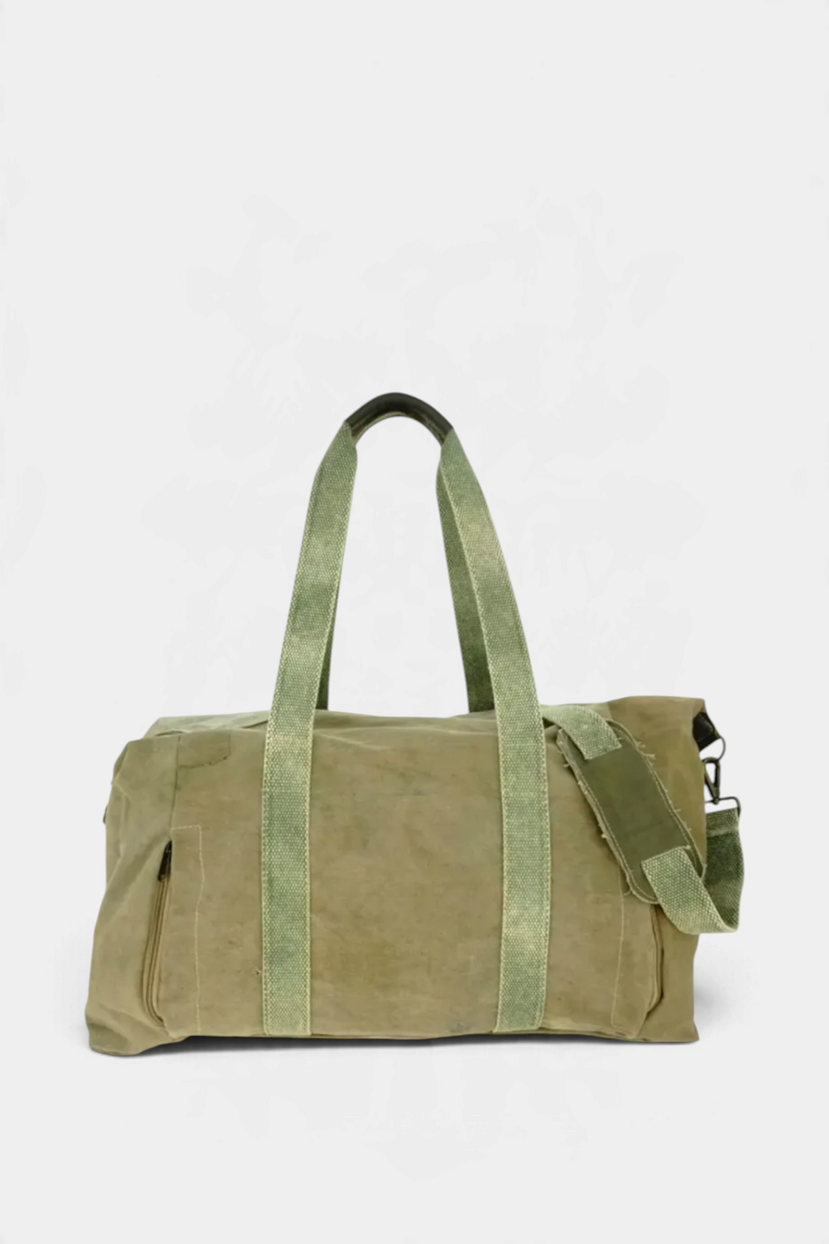 The Copper Shed recycled military tent weekender duffle bag in olive green with leather handles and shoulder strap.
