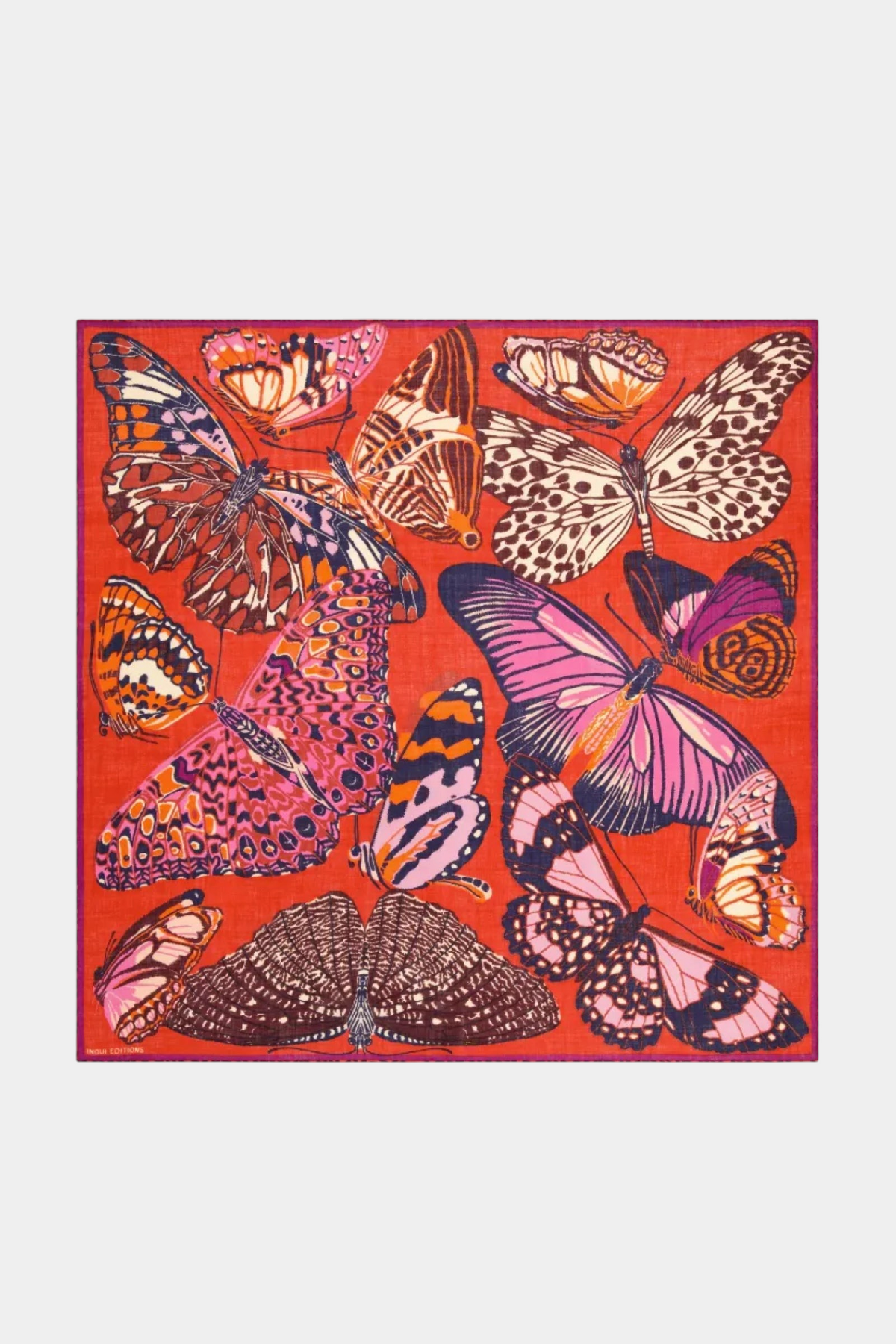 The Copper Shed square wool scarf in red featuring a vibrant multi-colored butterfly print pattern