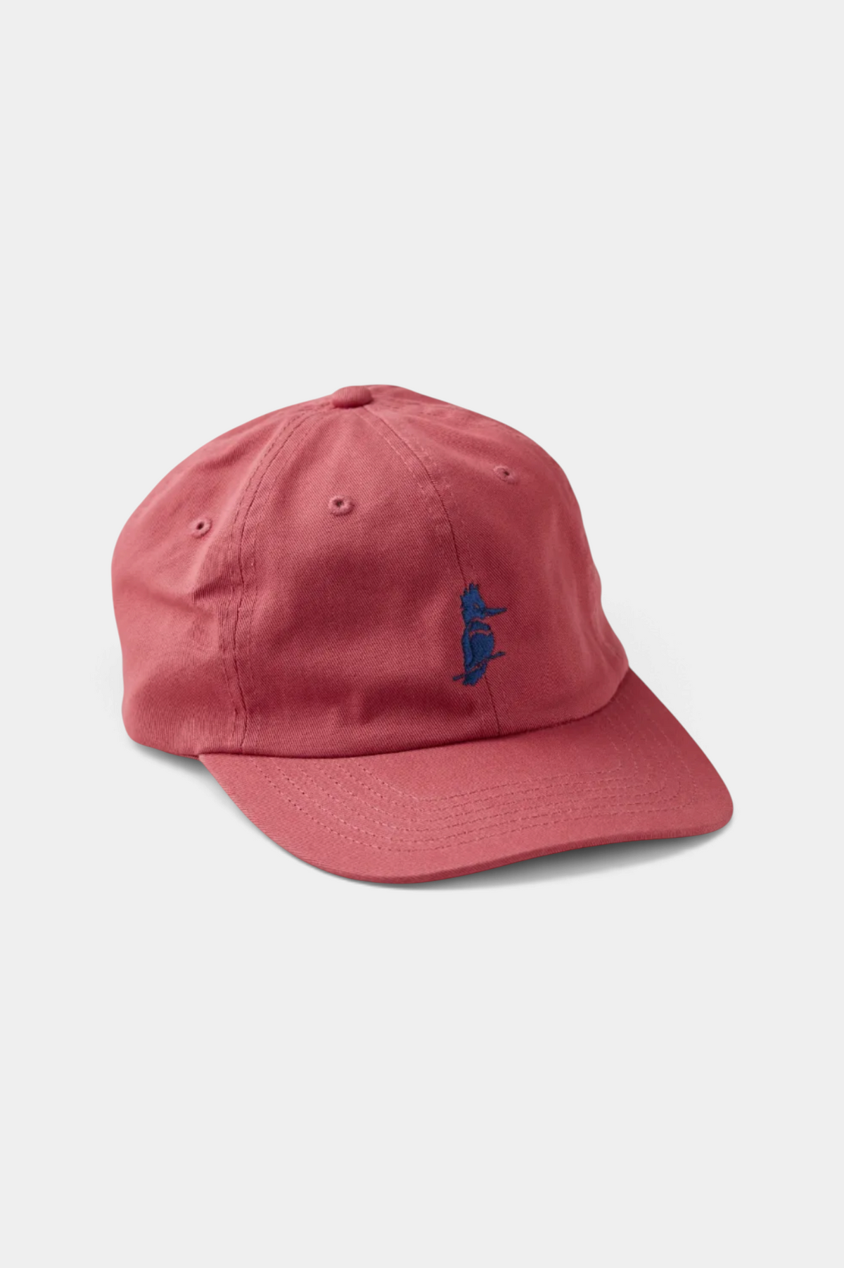 The Copper Shed Petey's dad hat in washed red cotton twill with unstructured profile and blue bird embroidery