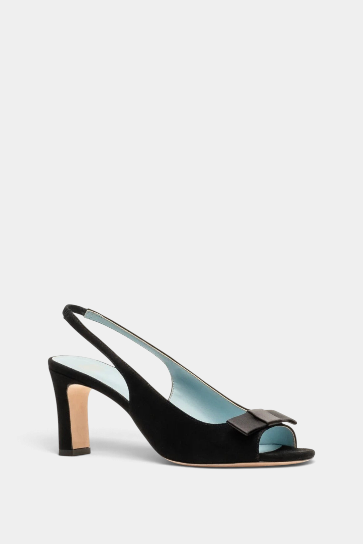 The Copper Shed Reese black suede slingback heel with an open toe, ankle strap, and decorative bow on the vamp.