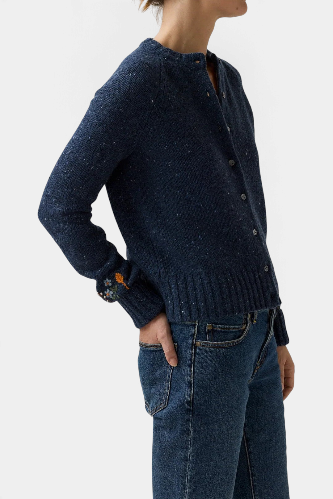 The Copper Shed Romy navy blue donegal wool and alpaca cardigan with delicate floral embroidery on the cuffs.