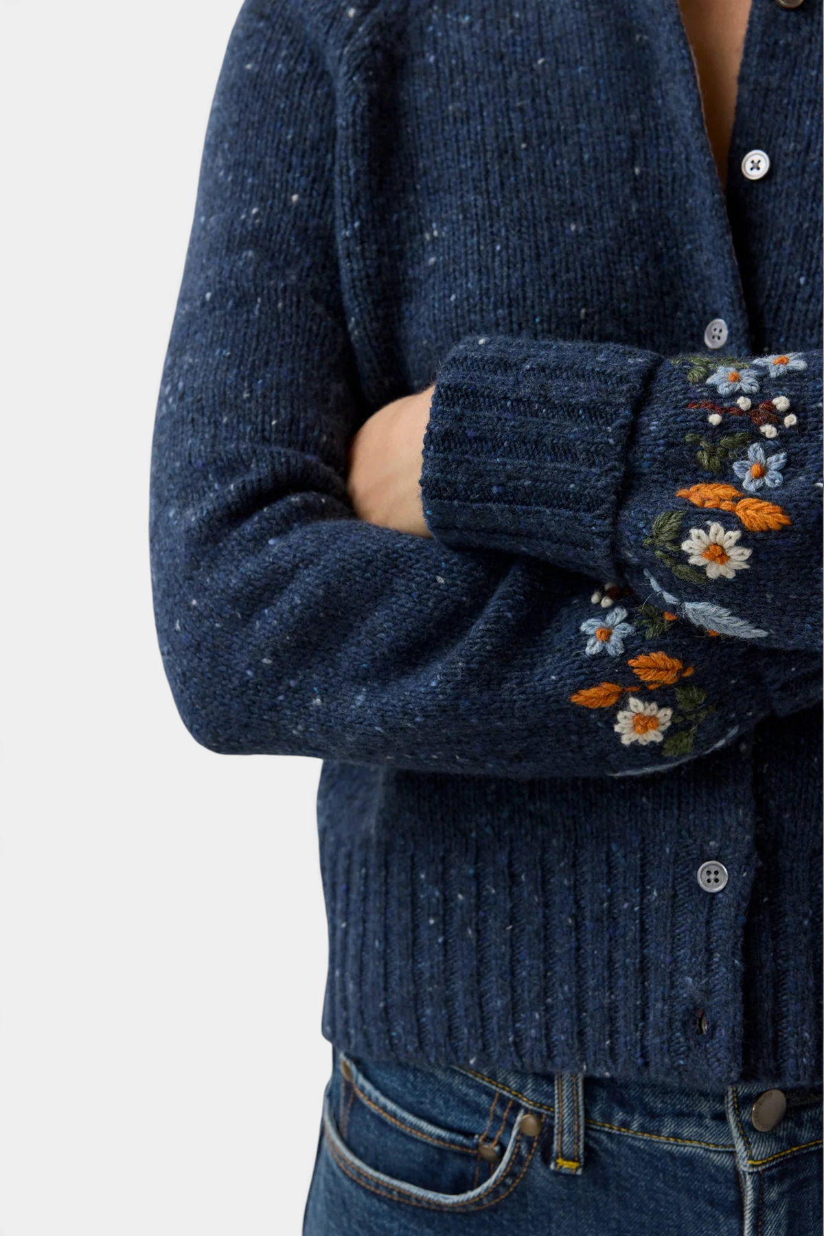 The Copper Shed Romy navy blue donegal wool and alpaca cardigan with delicate floral embroidery on the cuffs