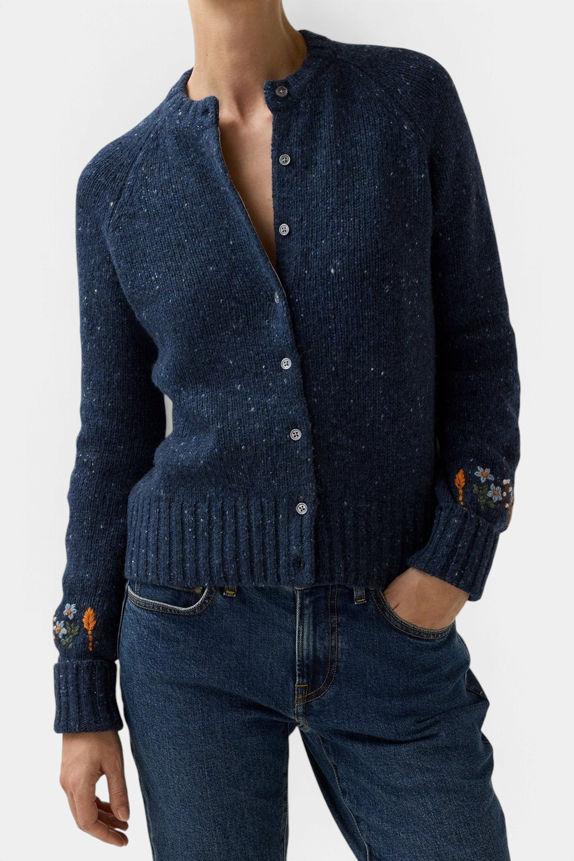 The Copper Shed Romy navy blue donegal wool and alpaca cardigan with delicate floral embroidery on the cuffs.