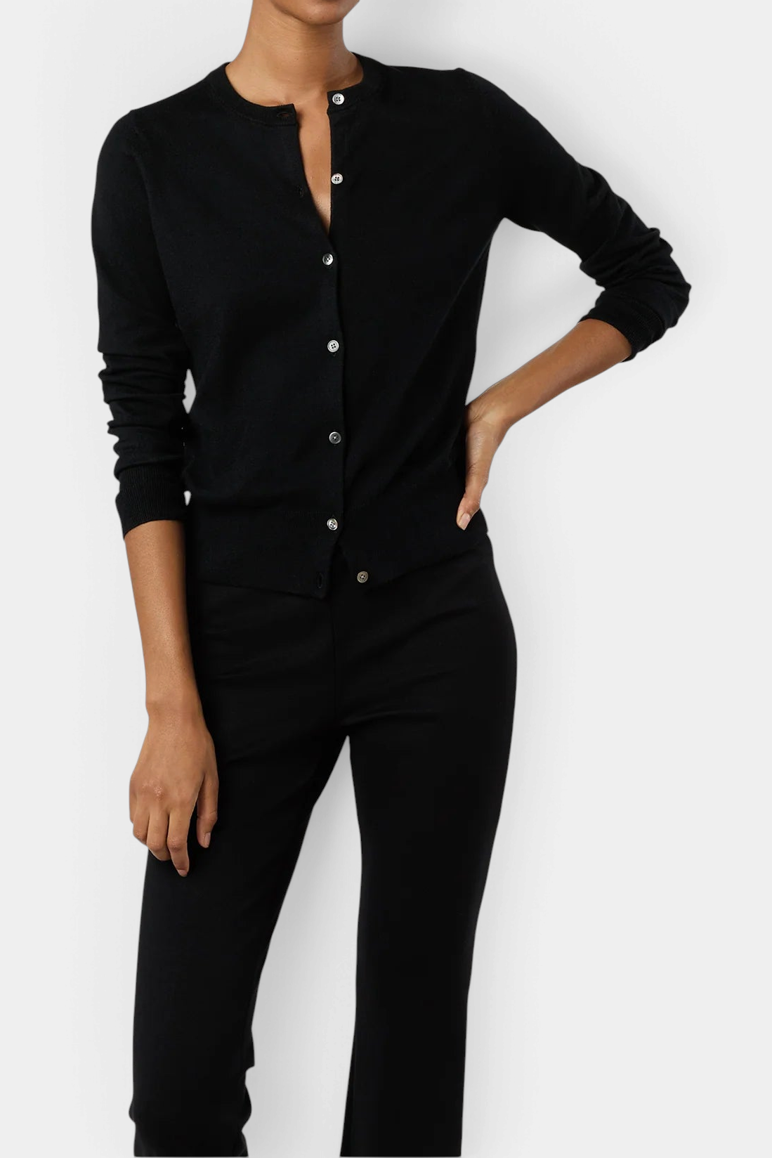 The Copper Shed Rosie black cotton-silk blend cardigan with jewel neckline and mother-of-pearl buttons on a model