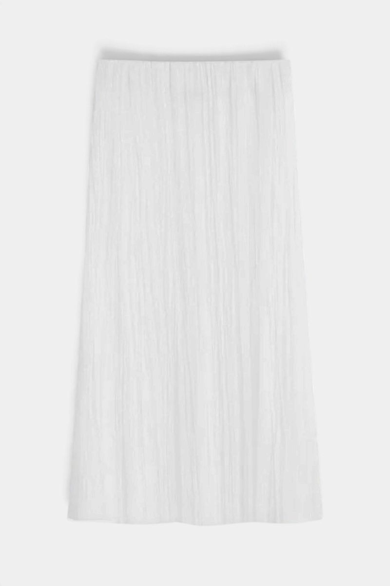 The Copper Shed Sabi white midi skirt featuring crinkle-pleated Japanese fabric and a comfortable elastic waistband.