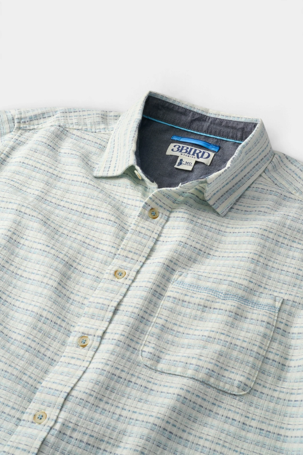 The Copper Shed Saltaire shirt in white and blue textured organic cotton dobby with a chest pocket and button front.