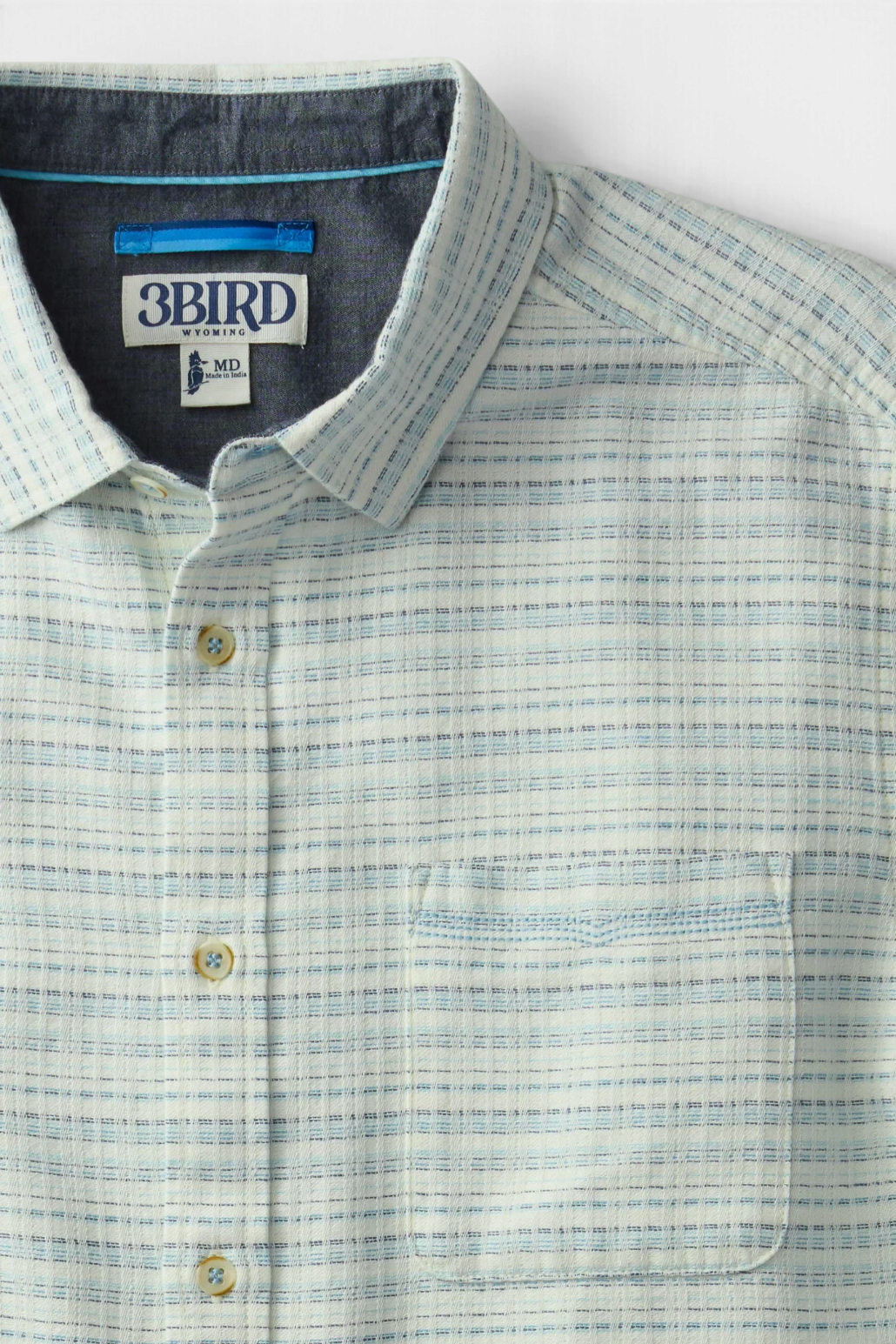The Copper Shed Saltaire shirt in white organic cotton dobby with blue horizontal stripes and a chest pocket.