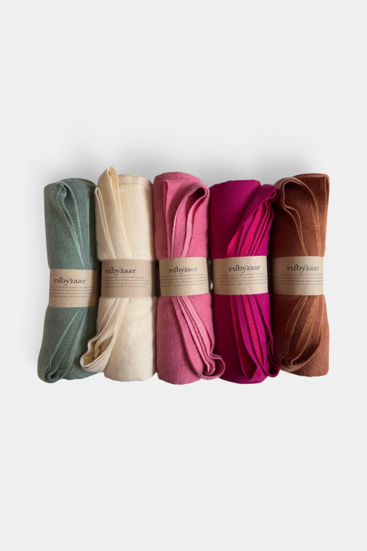The Copper Shed Sapa shawl collection featuring five rolled flannel and bamboo fabric wraps in assorted warm colors.