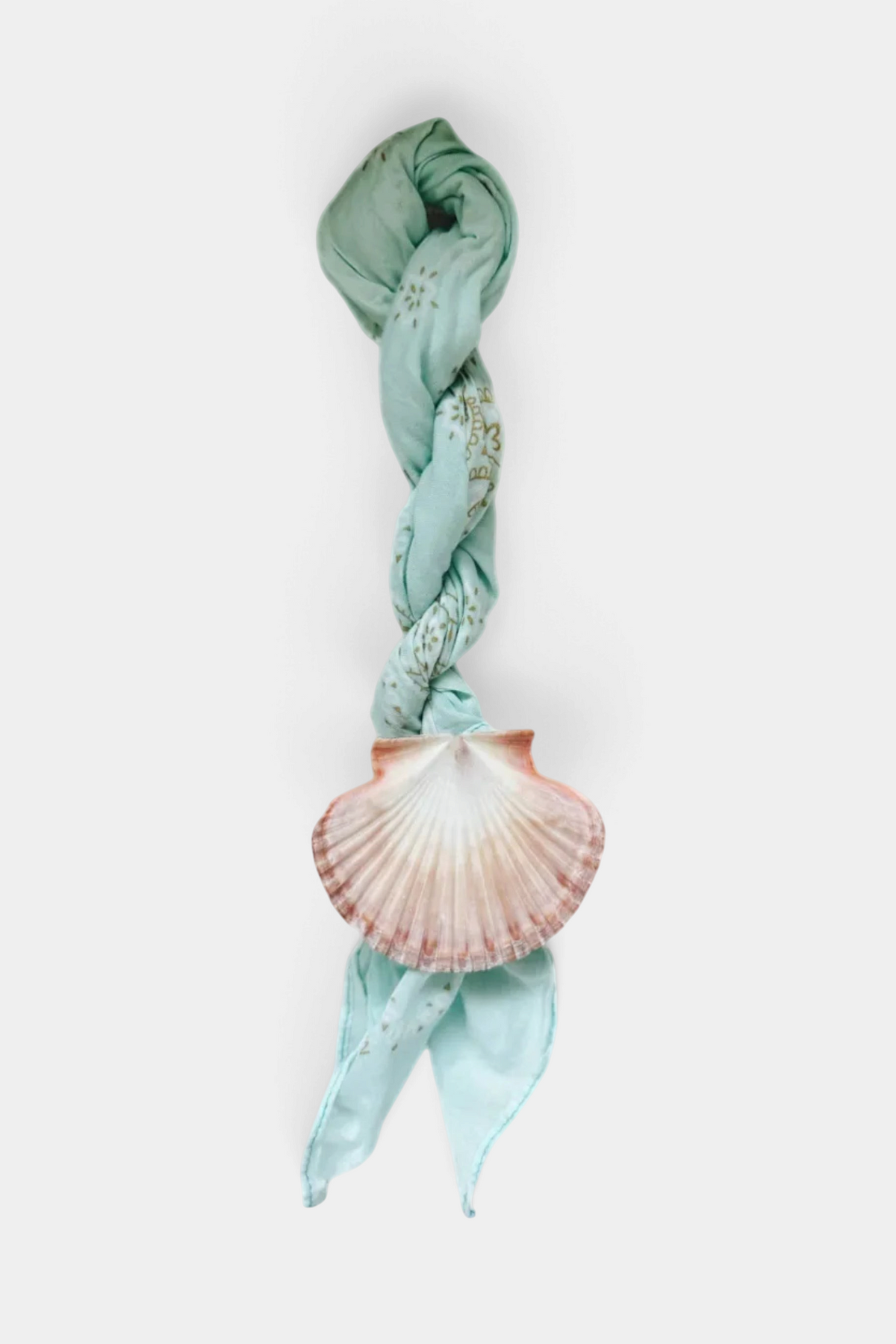 The Copper Shed Shell Yeah bandana ring tie featuring a natural flat scallop shell on a twisted light blue fabric