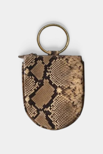 The Copper Shed snakeskin mini wristlet with a round brass handle and zipper closure for small essentials.