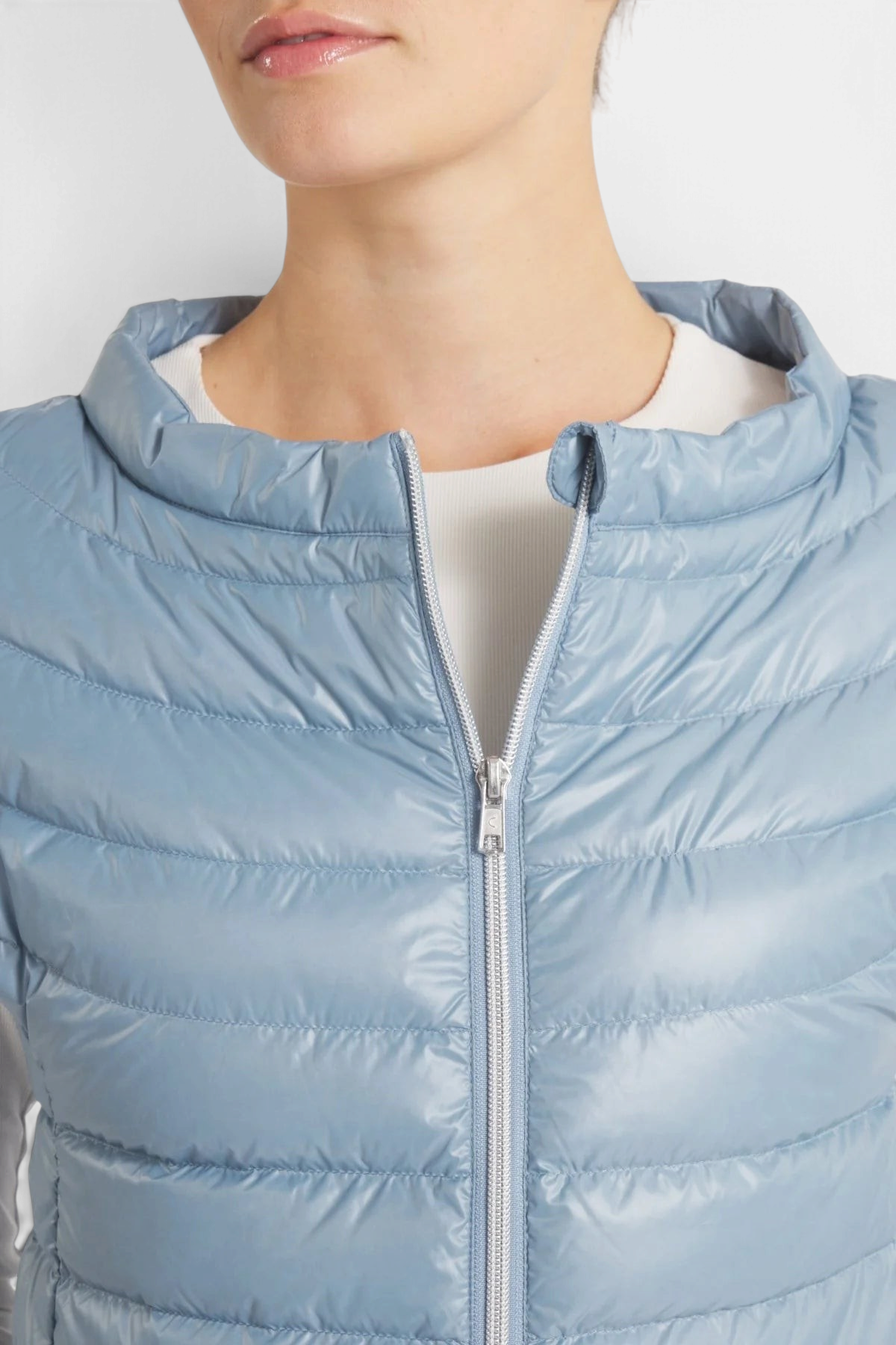 The Copper Shed St Ives light blue down vest with a premium 2-way coil zipper and soft quilted nylon fabric.