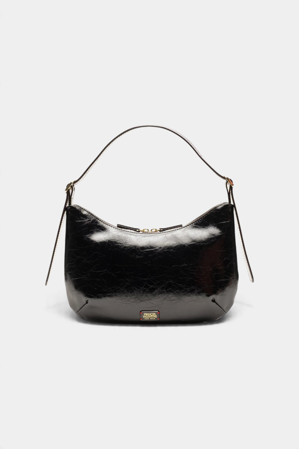 The Copper Shed Starr hobo bag in black crinkled leather with a crescent silhouette and adjustable shoulder strap.