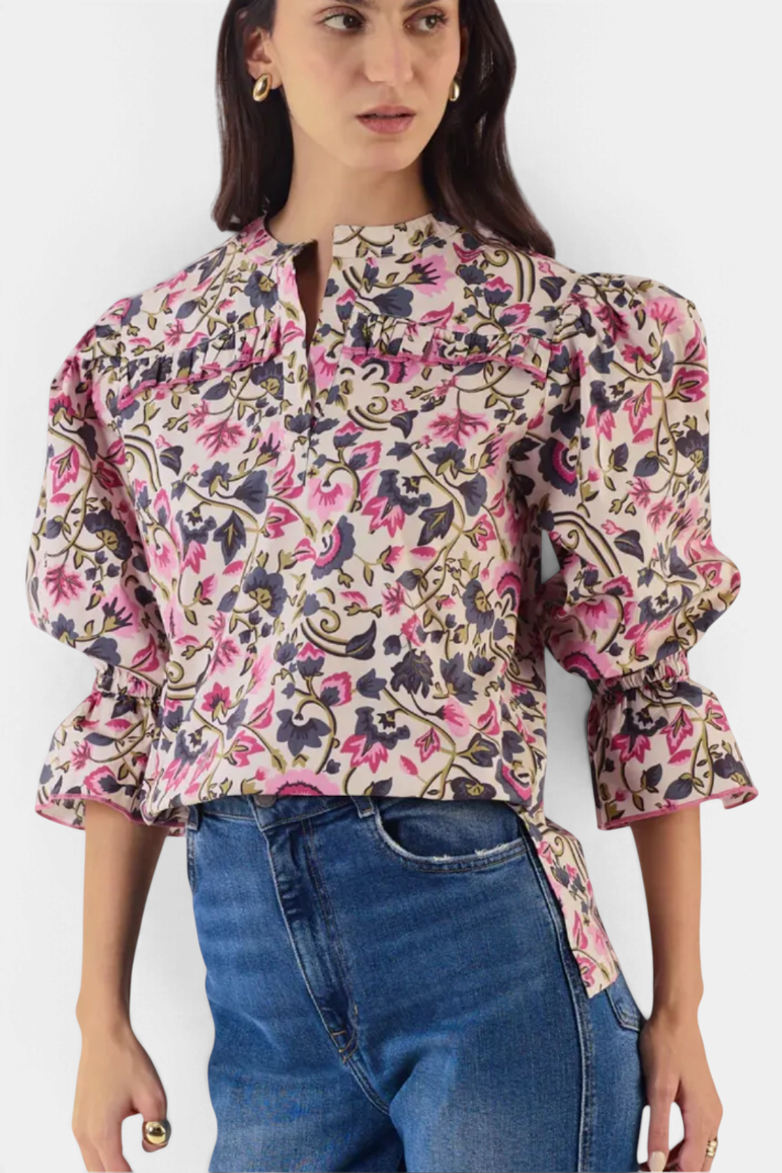 The Copper Shed Stella top in floral cotton poplin with puffed 3/4 sleeves and ruffle details worn with denim jeans.