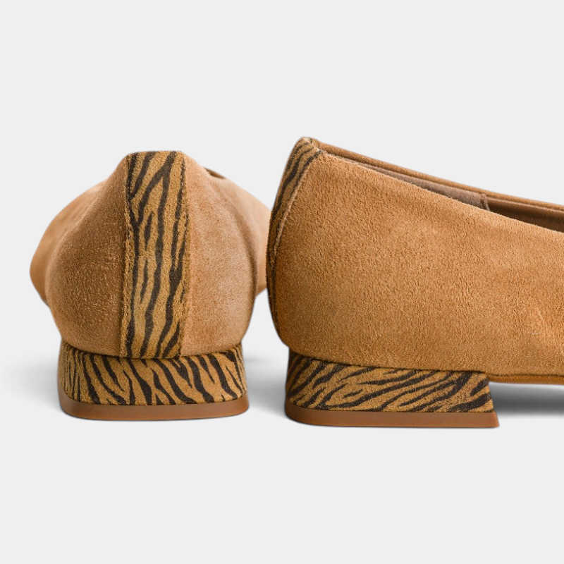 The Copper Shed Thea suede ballerinas featuring tan suede uppers and zebra-print leather heels, rear view.
