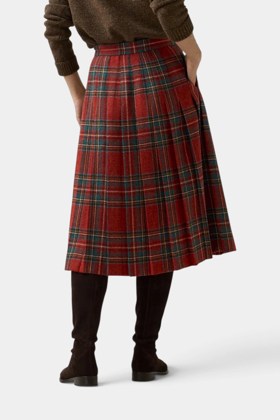The Copper Shed Royal Stewart tartan wool kilt skirt with adjustable leather hip straps, worn with tall brown boots.