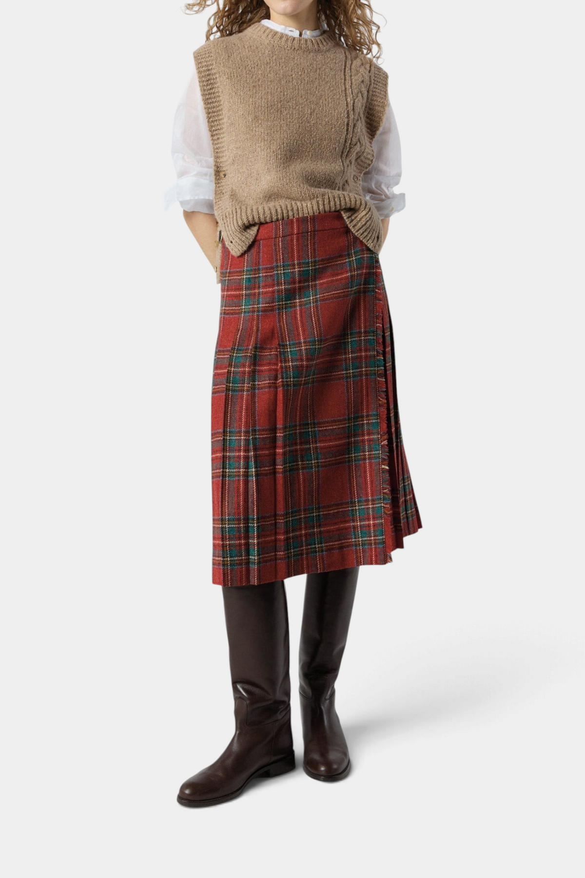 The Copper Shed Royal Stewart tartan wool kilt skirt with adjustable leather side straps worn with a beige sweater