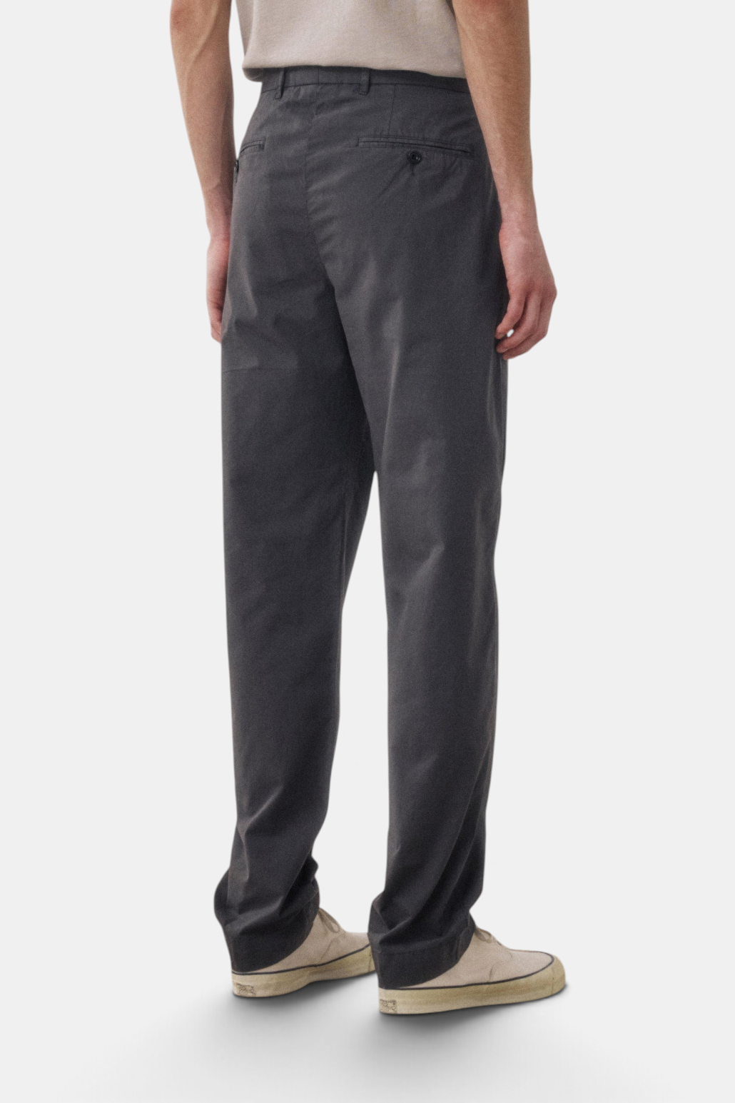 The Copper Shed Taylor straight-leg chino pants in charcoal cotton with back welt pockets, viewed from behind.