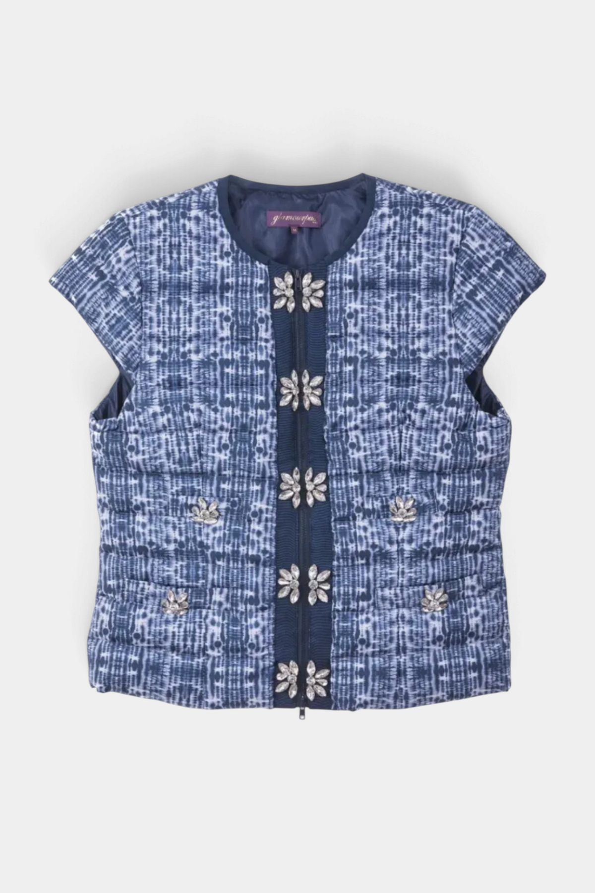 The Copper Shed blue tie dye cap sleeve vest with floral crystal embellishments and a front zip closure.