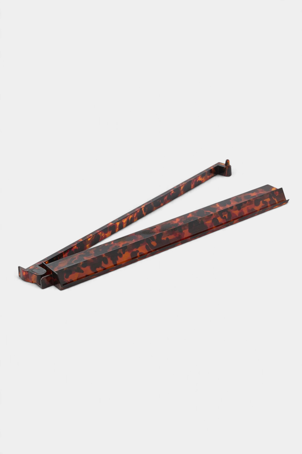 The Copper Shed tortoise shell acrylic mahjong rack and pusher set with a sleek, durable design for game nights.