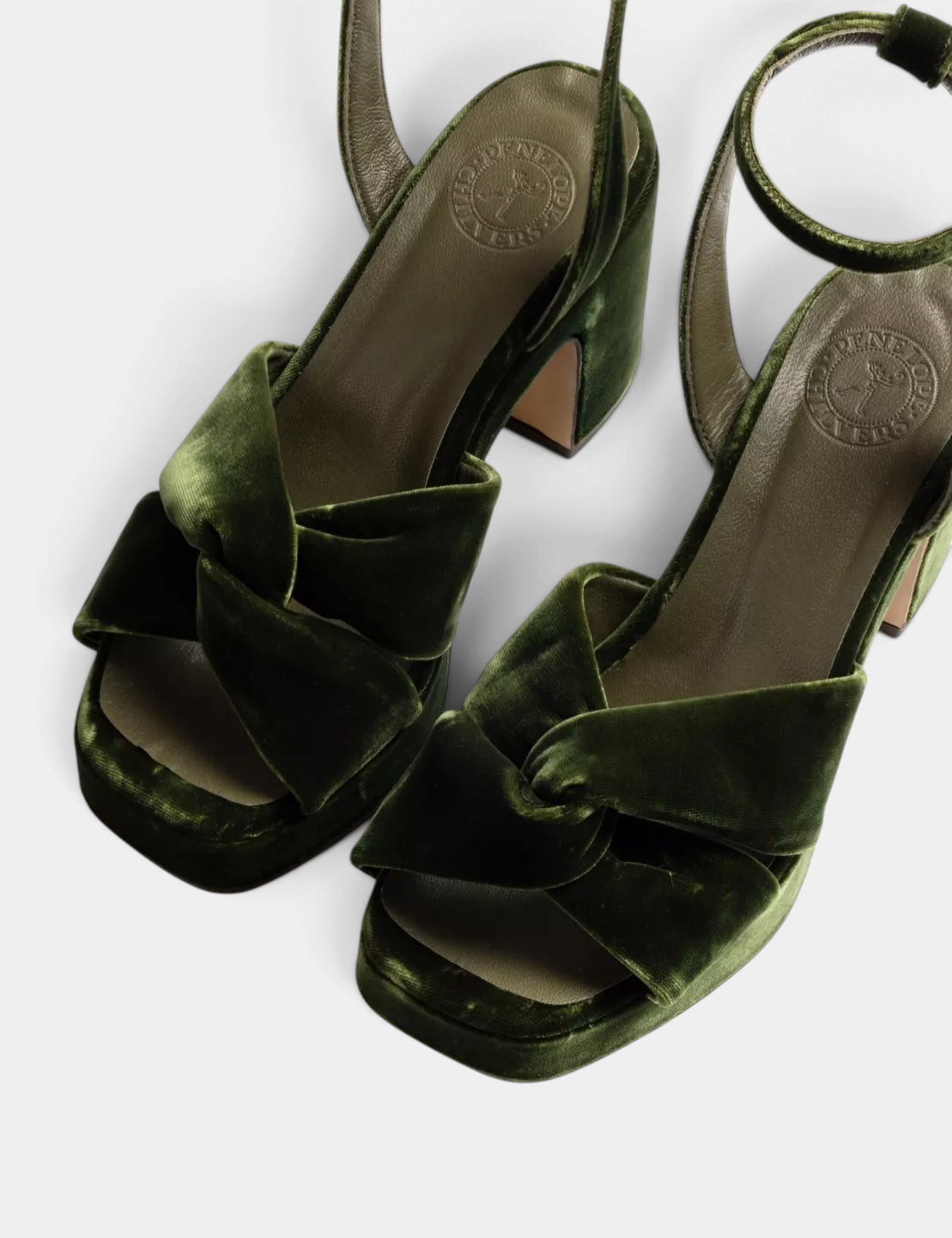 The Copper Shed Hibiscus platform sandals in verdigris velvet with a knotted front, block heel, and ankle strap.