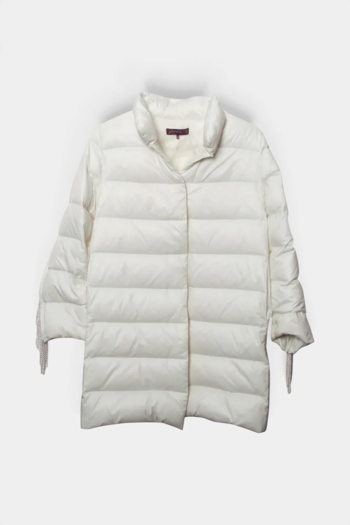 The Copper Shed white nylon down car coat with removable fringe sleeve accents and hidden snap closure.