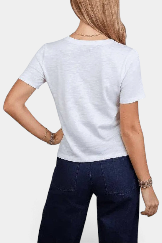 The Copper Shed white Pima cotton short sleeve tee worn by a woman, back view showing a simple casual fit.