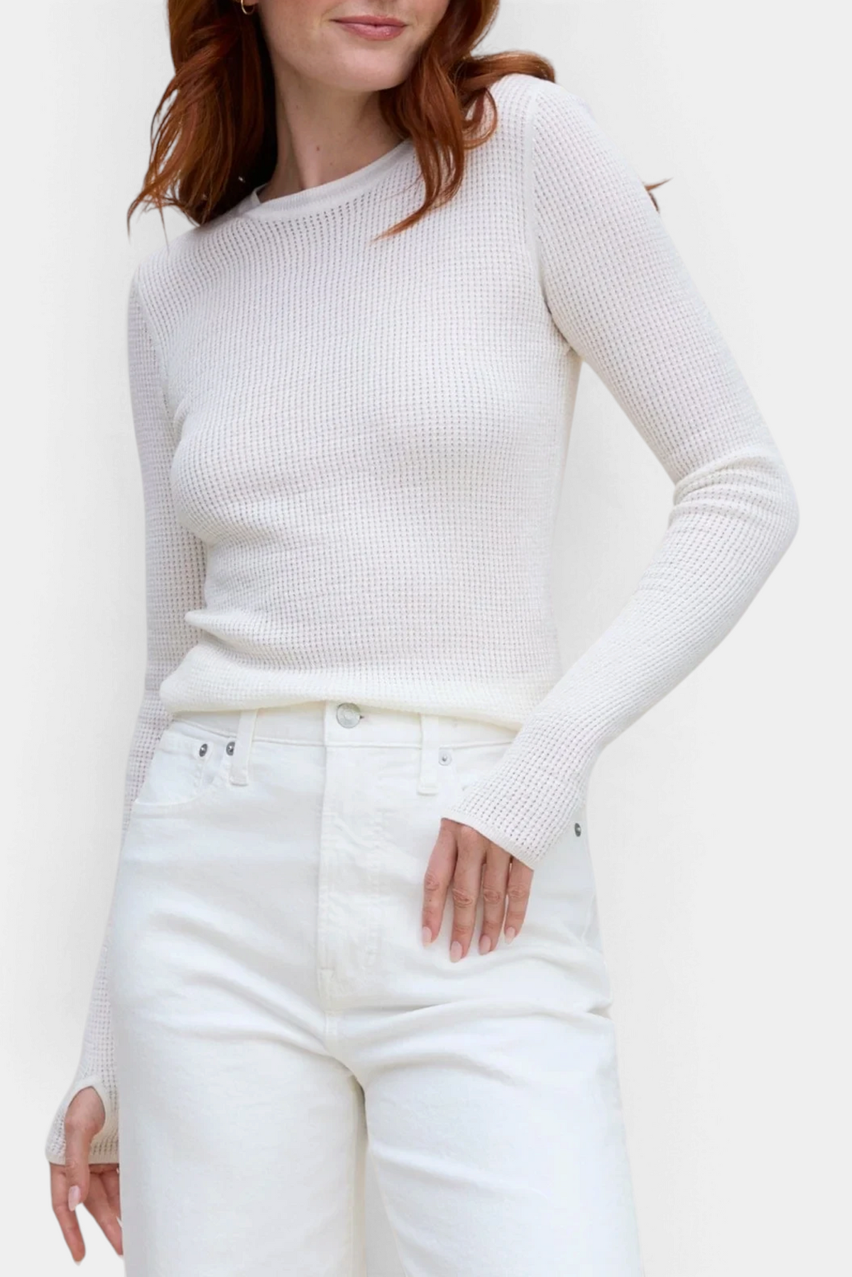 The Copper Shed white waffle knit crew neck long sleeve top with thumbholes worn by a woman with red hair