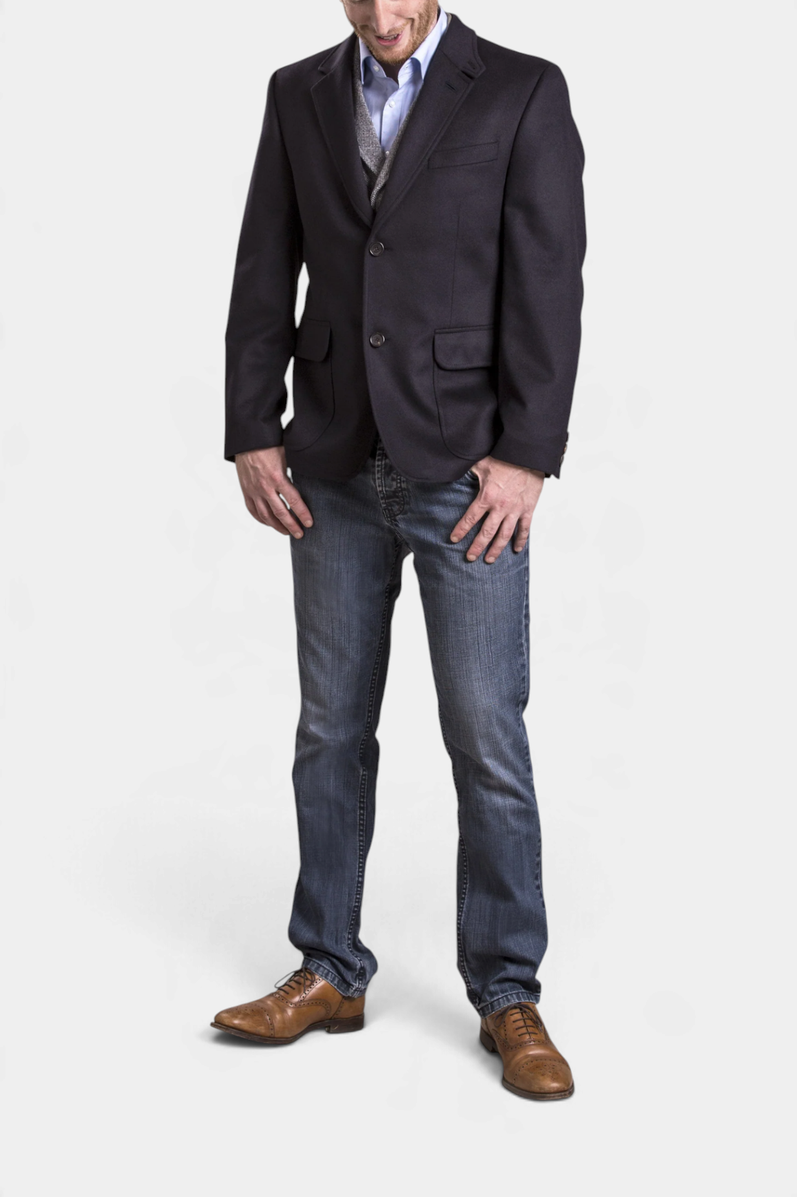 The Copper Shed Wilfred navy blue wool and alpaca blazer with shoulder pleats worn by a man with jeans and shoes