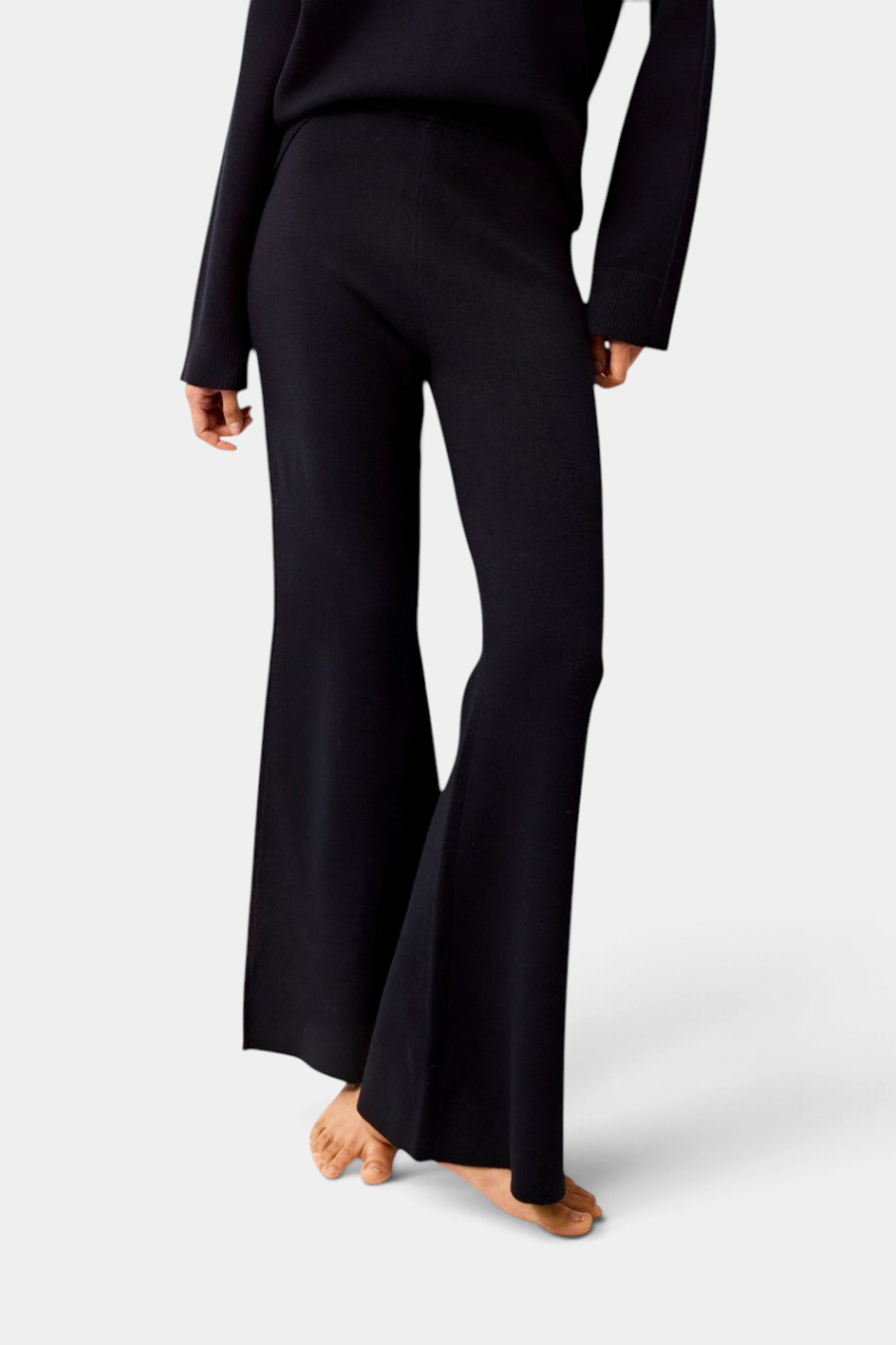 The Copper Shed Winnie black knit boot-leg pants with an elastic waistband worn with a matching sweater