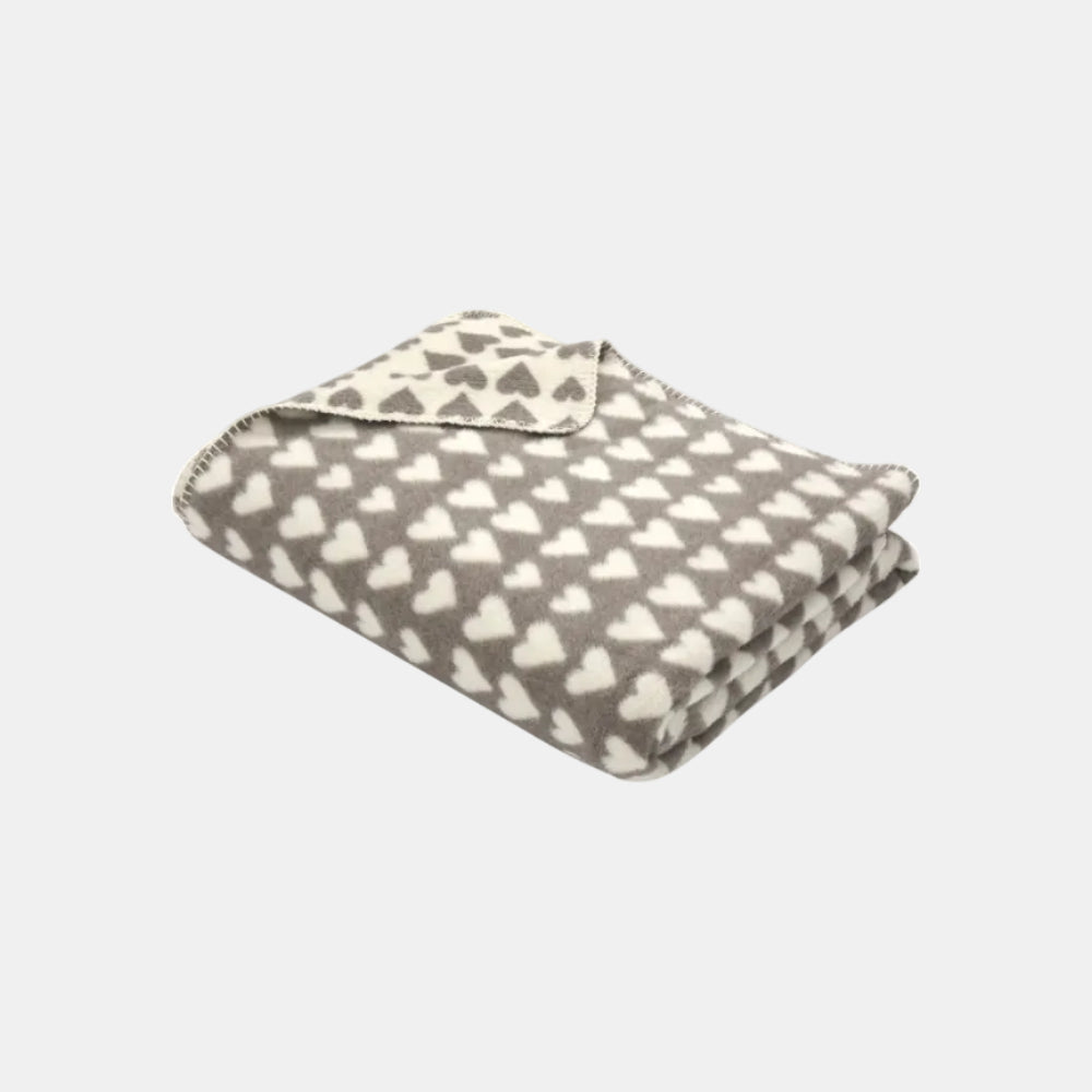 Flannel blanket with heart pattern on a white background