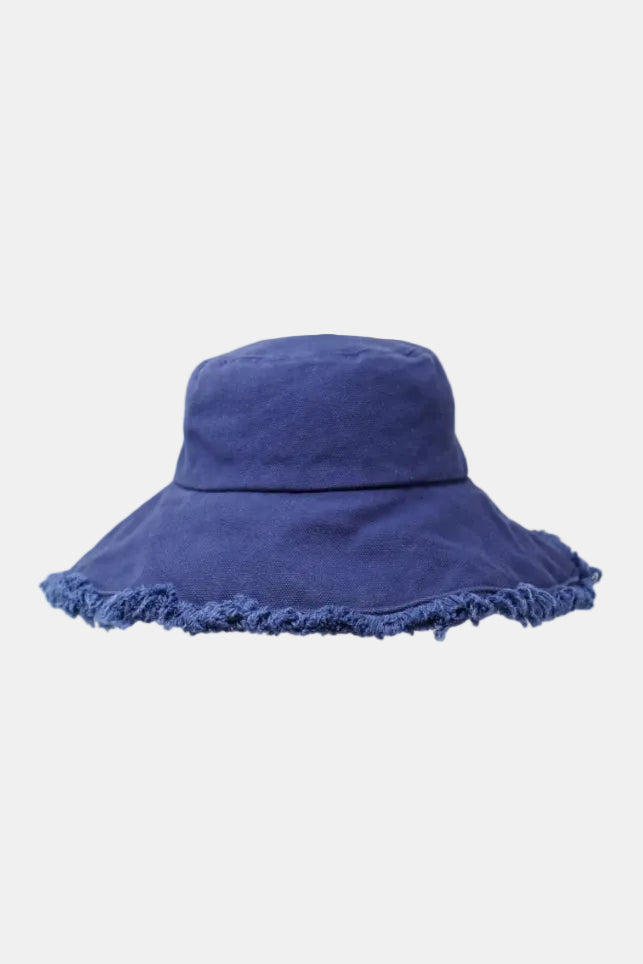 Blue bucket hat with frayed edge on a white background