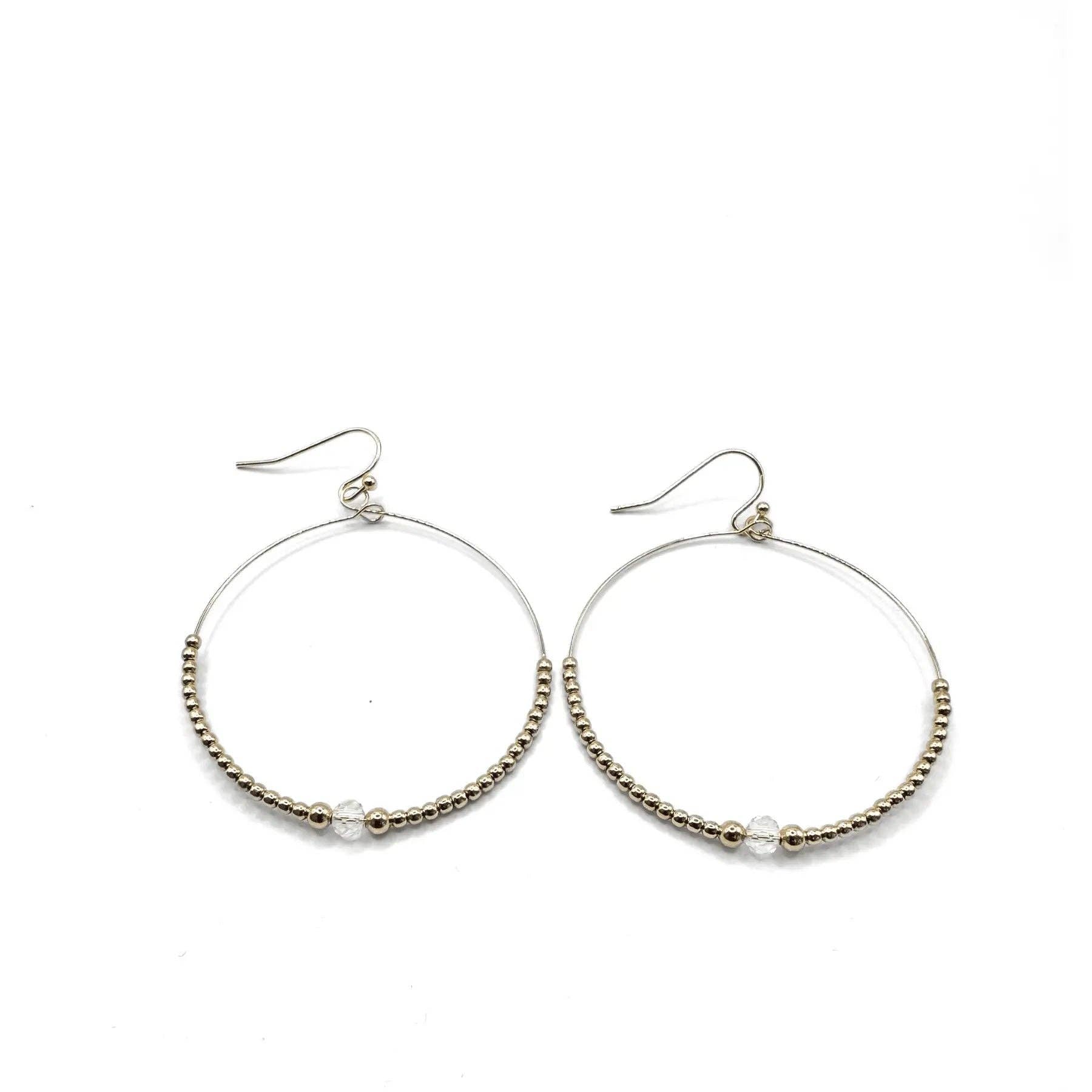 Hoop earrings with bead detailing on a white background
