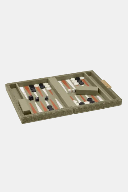 Backgammon set with pieces on a beige board