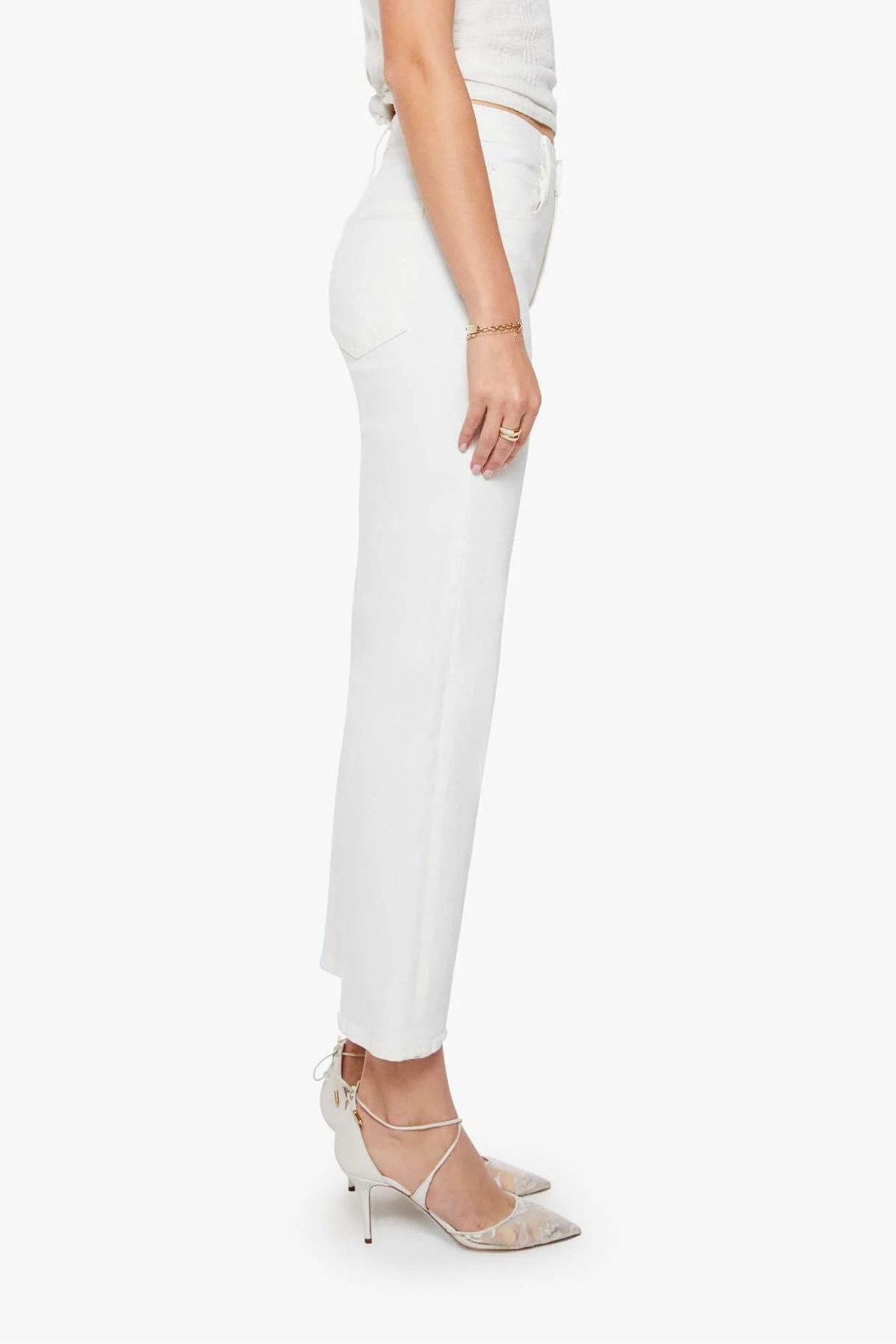 Woman wearing a white outfit on a white background