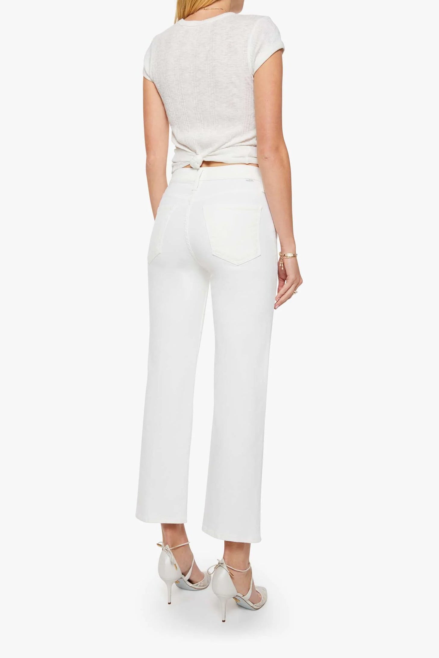 Woman wearing a white outfit on a white background