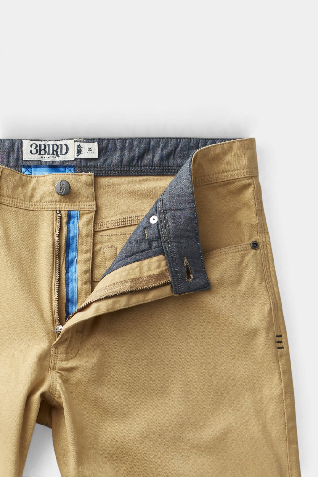 The Copper Shed Breakout broken twill pants in tan with a zipper fly, blue interior detailing, and 5-pocket styling.