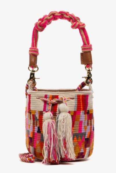 Colorful handbag with braided handle and tassels on a white background