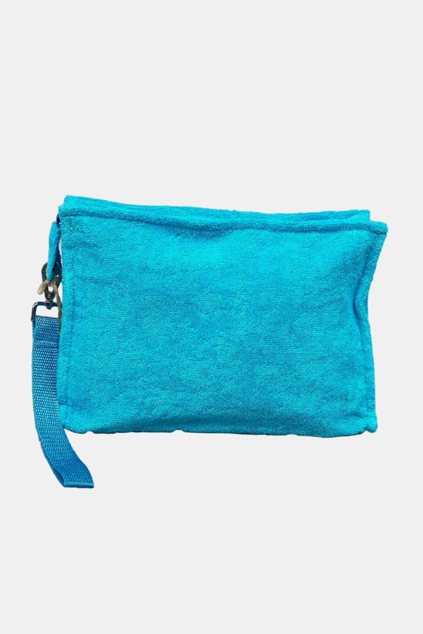 Blue pouch with a strap on a stone surface and stone wall background