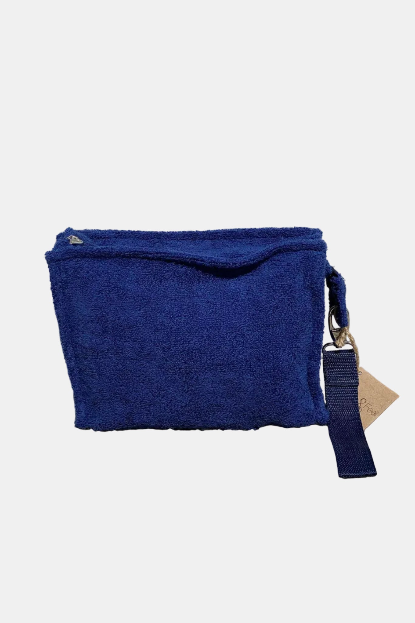 Blue pouch with a strap on a stone surface
